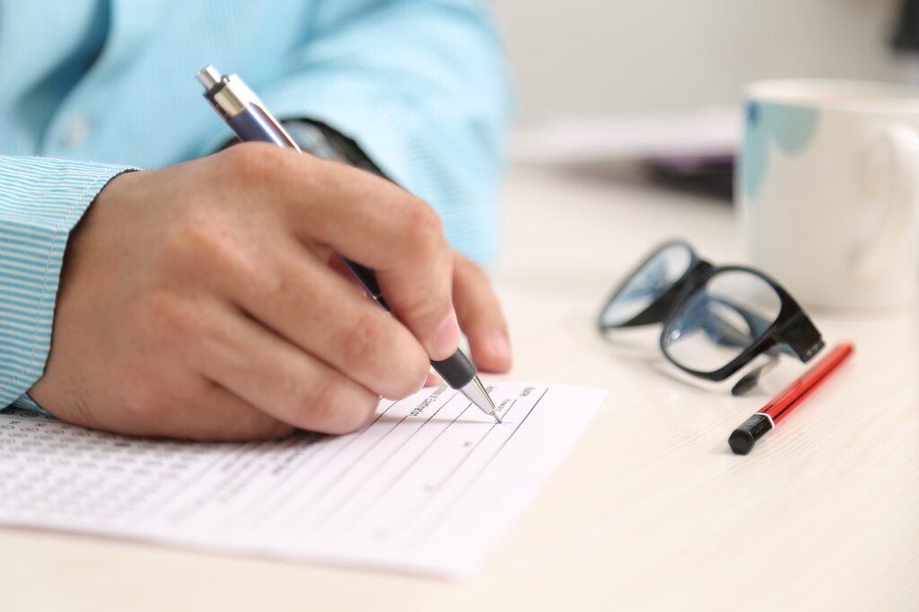 image showing a men or boy writing a diary