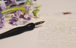 image showing a diary page decorated with calligraphy hand writing and flowers