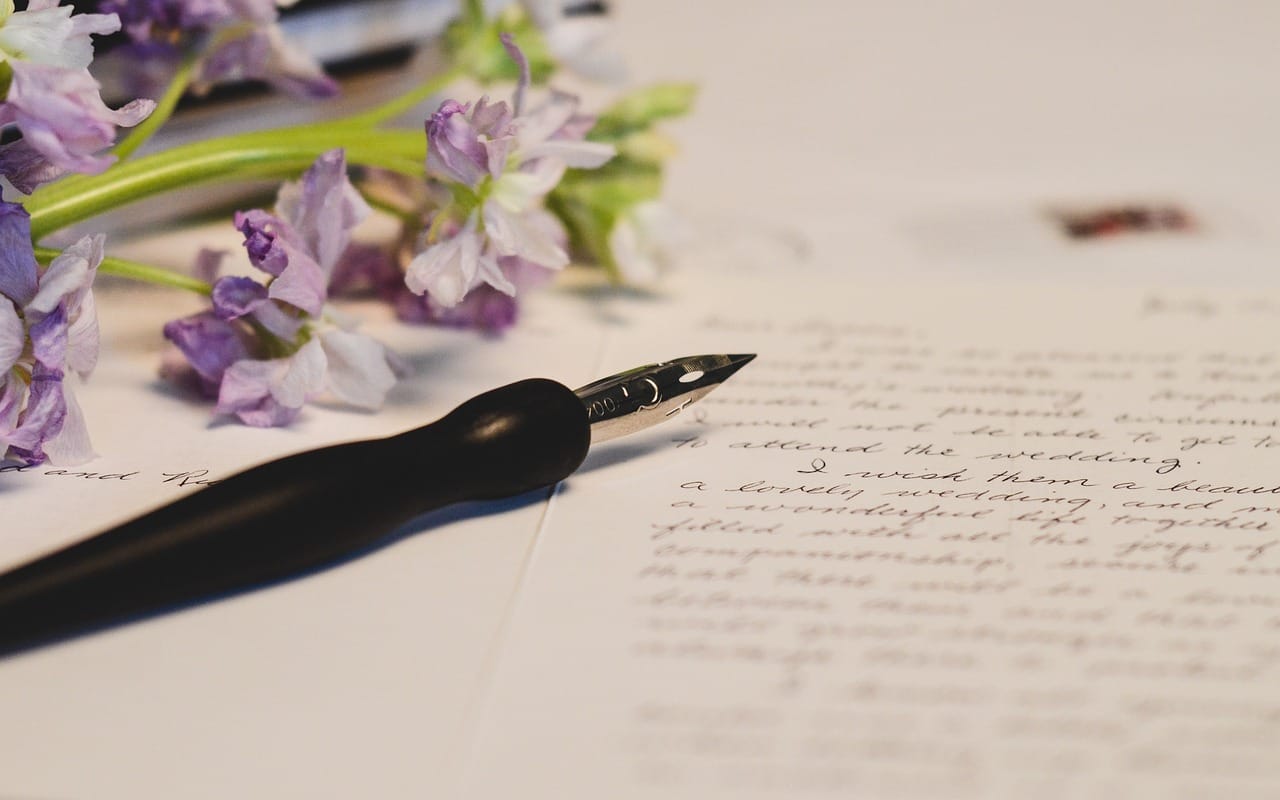 image showing a diary page decorated with calligraphy hand writing and flowers