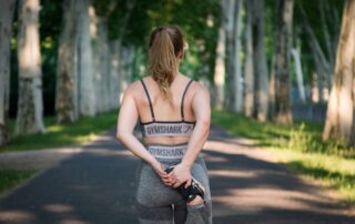 image showing a women working out on her self improvement routine - example of fitness routine
