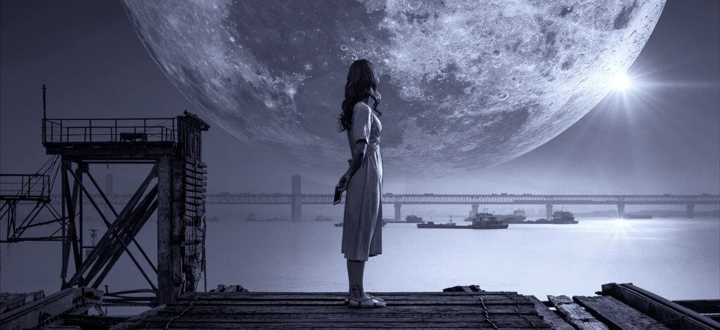 image showing a girl watching calmly towards the moon