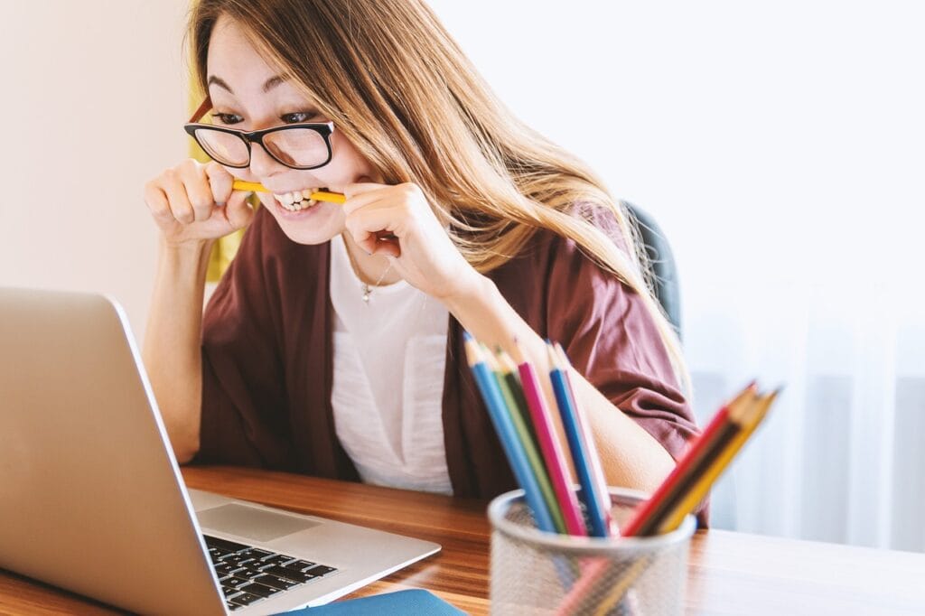 image showing a woman improving her skills through education from social media accessed using her laptop