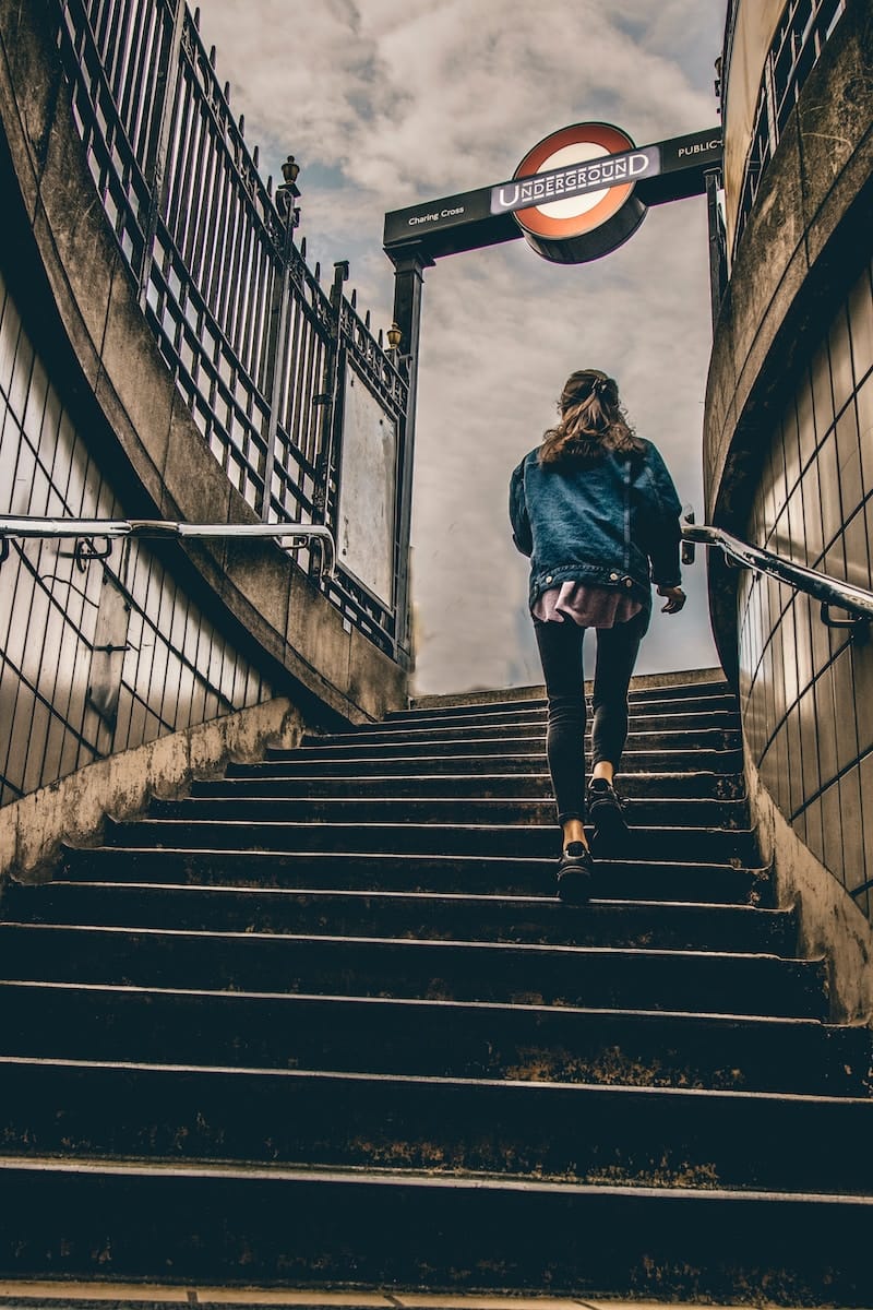 image showing a person walking on steps confidently