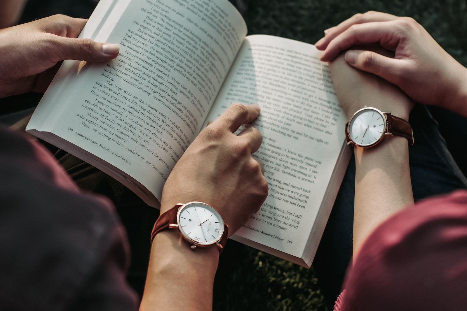 image showing a couple reading book together and enjoying their time